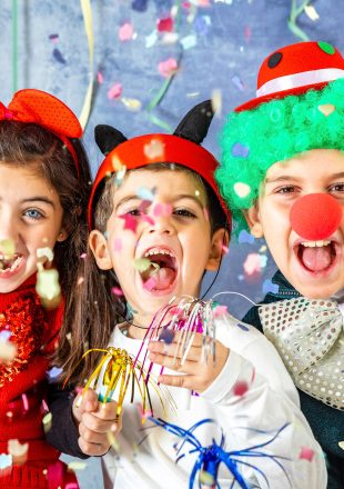 Three kids celebrating Carnival together at home Three kids celebrating Carnival together at home