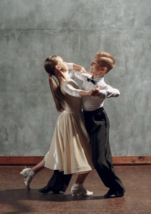 Young boy and girl dancing in ballroom dance Viennese Waltz Young boy and girl dancing in ballroom dance Viennese Waltz.