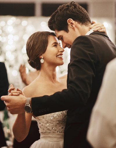 Cropped shot of an affectionate young newlywed couple dancing alongside their guests on their wedding day